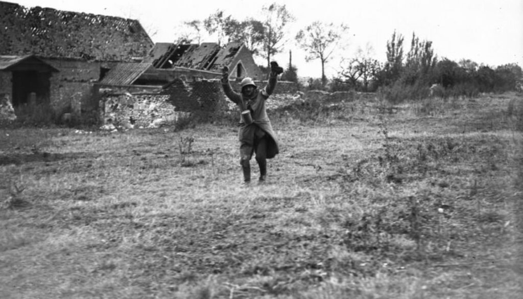 228_A German running in to give himself up just on the outskirts of Cambrai. Advance East of Arras. October, 1918.